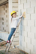 © Aliaksei Lasevich - little girl with helmet working on construction