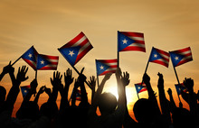 Group Of People Waving Flag Of Puerto Rico