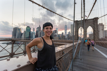 Wall Mural - Happy Young Woman on Brooklyn Bridge