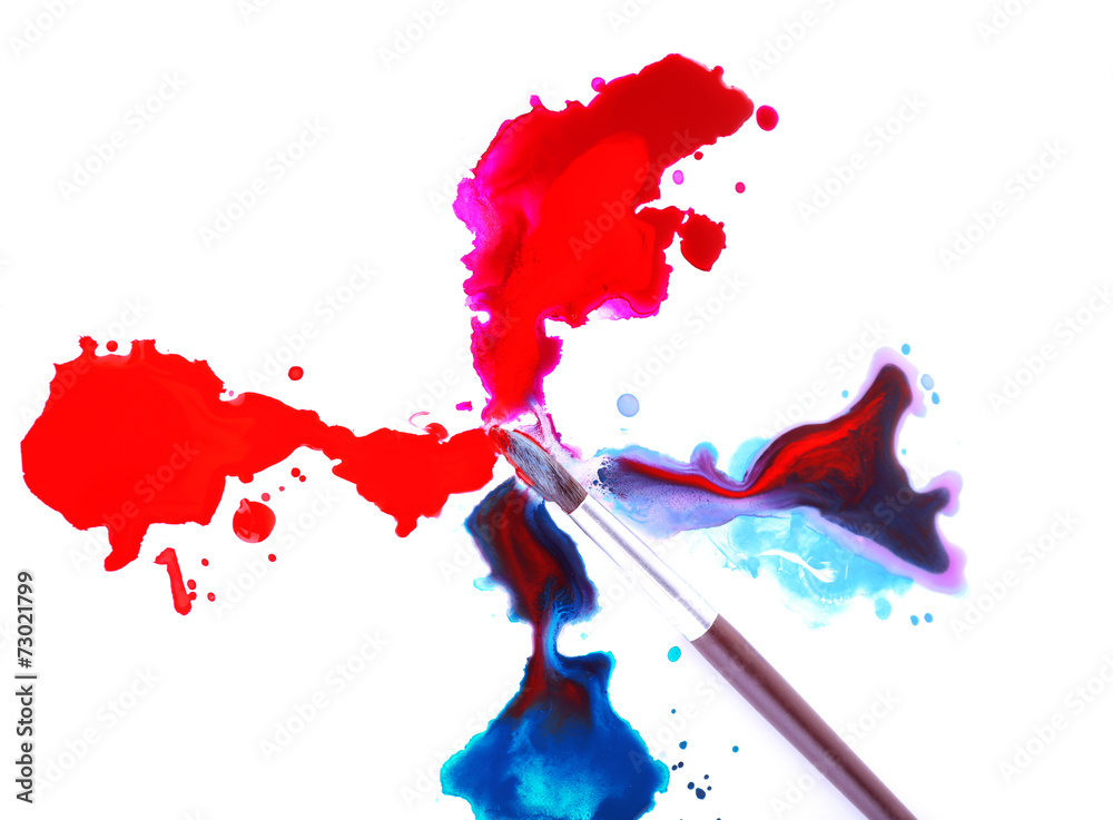 Brush and spilled paint isolated on white