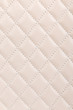 Milky white quilted leather background