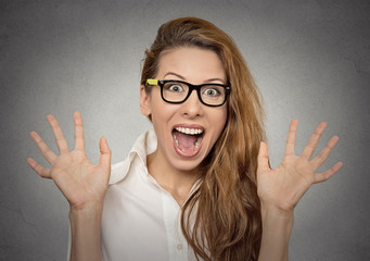 super excited funky young girl with glasses looking thrilled