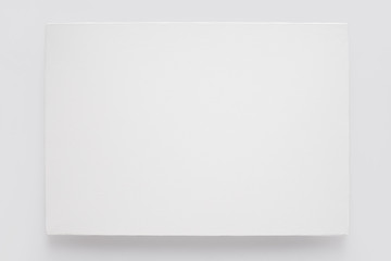 white canvas on stretcher on white wall, clipping path