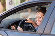 © DariaTrofimova - woman sitting in  black car.