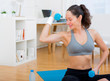 © Production Perig - Young attractive girl doing exercise at home