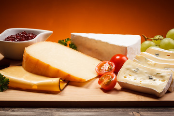 Wall Mural - Cheese on cutting board