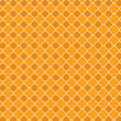 Repeating orange quatrefoil trellis background