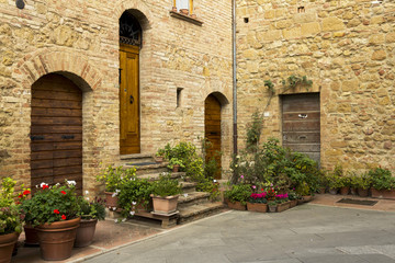 Wall Mural - Street corner with old vintage doors in Tuscany