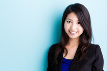 Asian Businesswoman On Blue Background