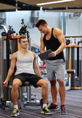 Poster - men exercising on gym machine