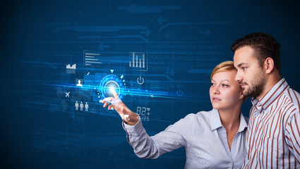 Poster - Young business couple touching future web technology buttons and