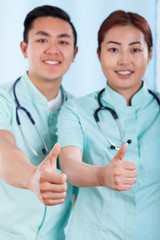 Wall Mural - Couple of doctors with okay gesture