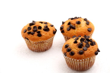 chocolate chip muffin on a white background.