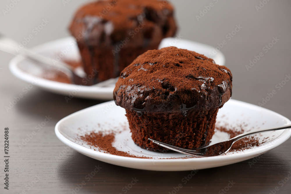 Yummy chocolate cupcake on table