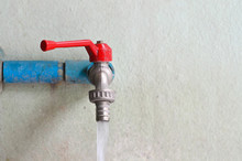 Faucet On Concrete  Wall
