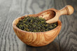 oolong green tea in wood bowl