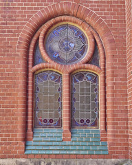 church window and red brickwall, altenburg, germany