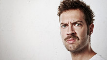 Portrait Of An Angry Man With Mustache