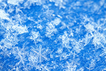 Blue White Winter Background From Snowflakes Blur