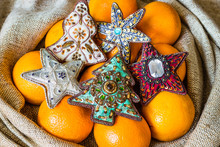 Christmas Tree Ornaments And Oranges Lying In Sack