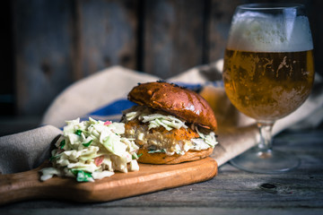 Wall Mural - Rustic fish burgers with coleslaw and beer