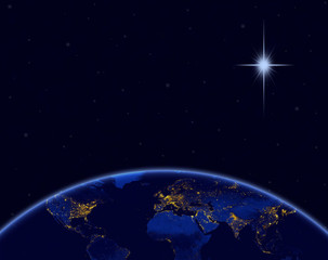 Wall Mural - planet earth and christmas star in night sky