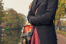 Woman Standing By Houseboat