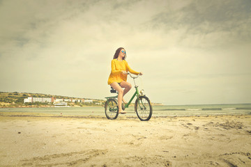 Wall Mural - A cyclist at the beach