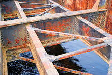 Rusted Bridge Girders Over Water