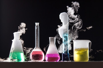 glass in a chemical laboratory filled with colored liquid during