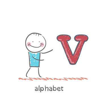 man standing with a letter of the alphabet