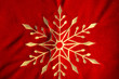 embroidered white snowflake on red velvet