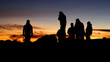 © shkonst - Human silhouettes in sunset