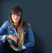© goodluz - Portrait of young trendy girl on dark background
