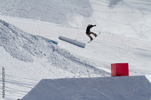Fotografie, Obraz Snowboarder jumps in Snow Park, ski resort