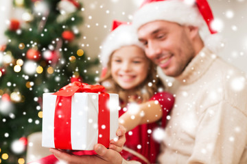 Poster - smiling father and daughter holding gift box