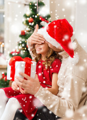 Poster - smiling father and daughter holding gift box