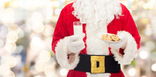 Santa Claus With Glass Of Milk And Cookies