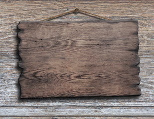 old wood plank or plate hanging on timber plank wall