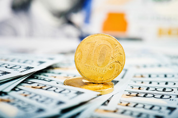 Wall Mural - russian roubles coins on banknotes of  dollars