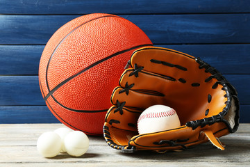 Wall Mural - Sports balls on wooden background