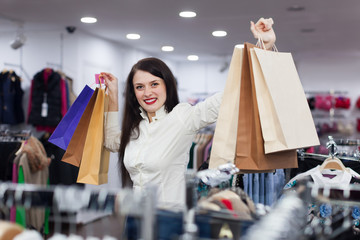 Wall Mural - Joyful girl with shopping bags