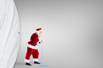 Poster - Composite image of santa claus pulling rope