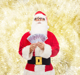 Canvas Print - man in costume of santa claus with euro money