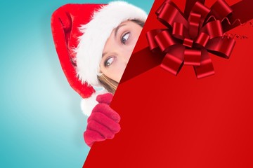 Poster - Composite image of festive blonde holding a poster