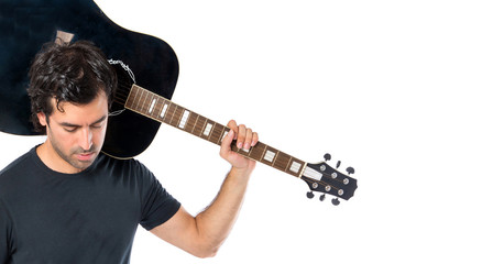 Wall Mural - Handsome man with guitar over white background