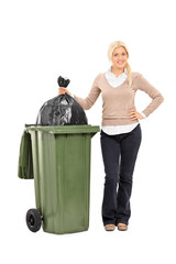 Canvas Print - Young woman throwing out the trash