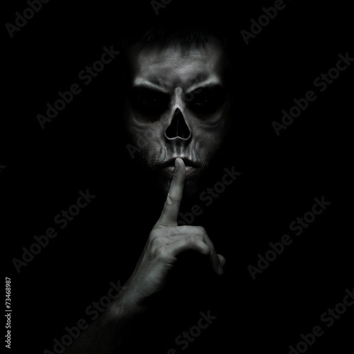 Fotomural Evil man gesturing silence, quiet isolated on black background