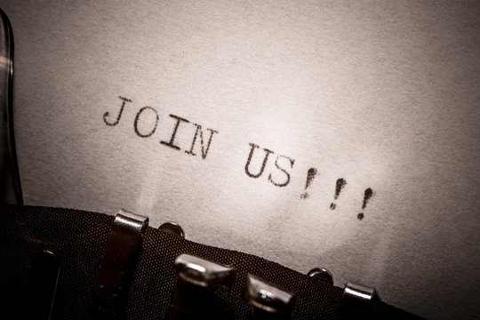 old typewriter with text join us