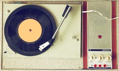 Wall Mural - top view of old record player, image is retro filtered  